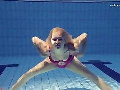 Swimsuit woman wants to swim naked in the pool